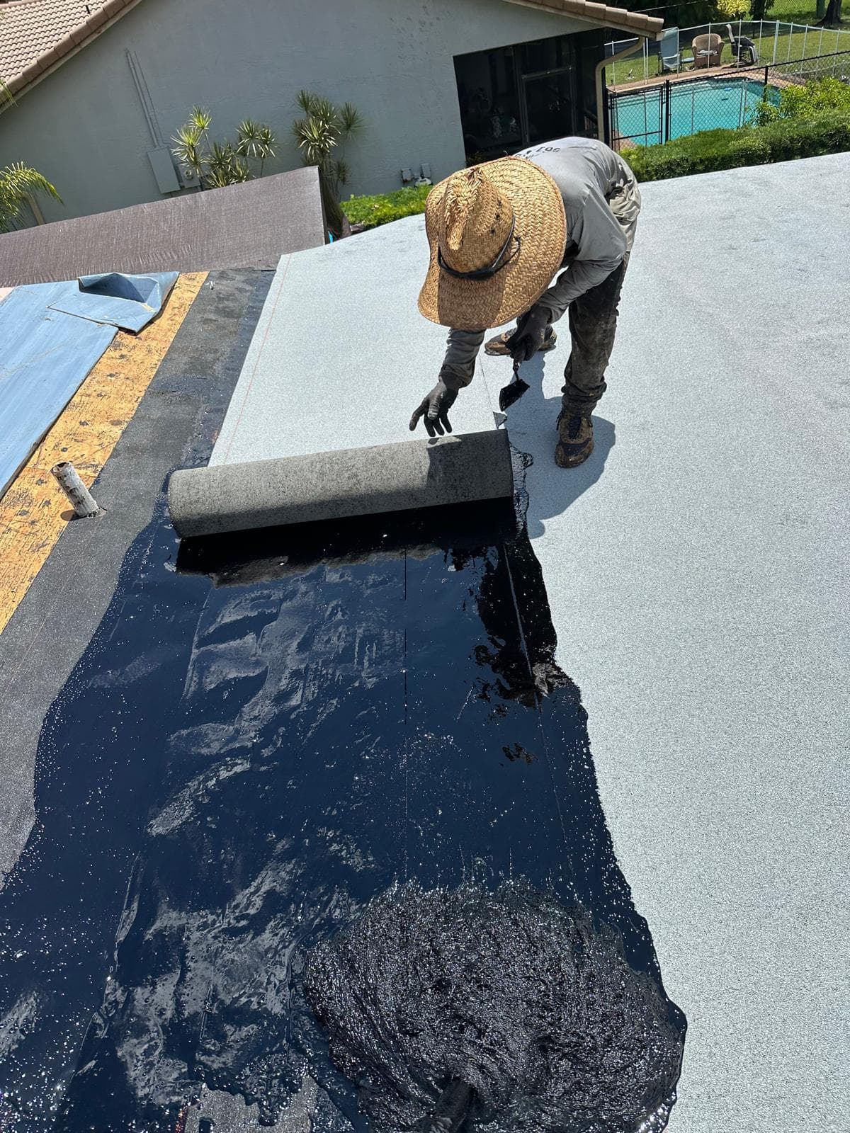 Hot mop built-up roofing, cap sheet going down